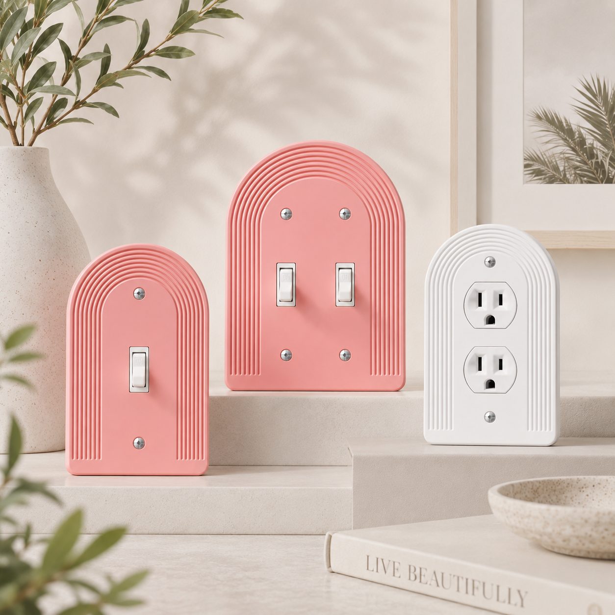Portico plates in Porcelain, Rosé, and Coral, styled on a shelf